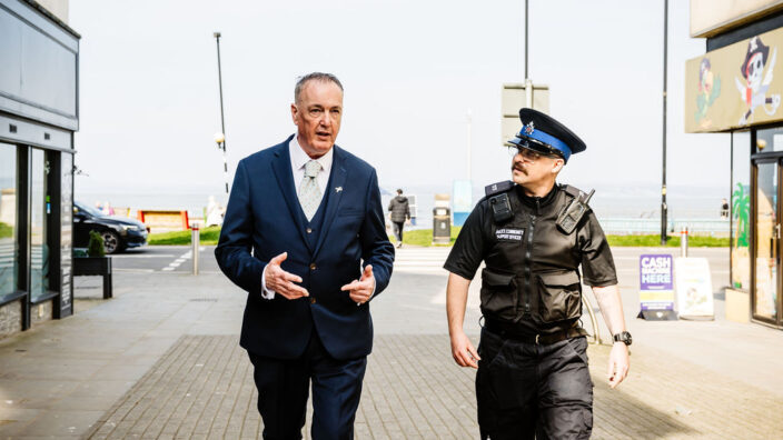 Commissioner Clive Grunshaw with officer