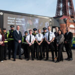Clive Grunshaw standing with officers and staff in Blackpool at the launch of the Nightsafe campaign