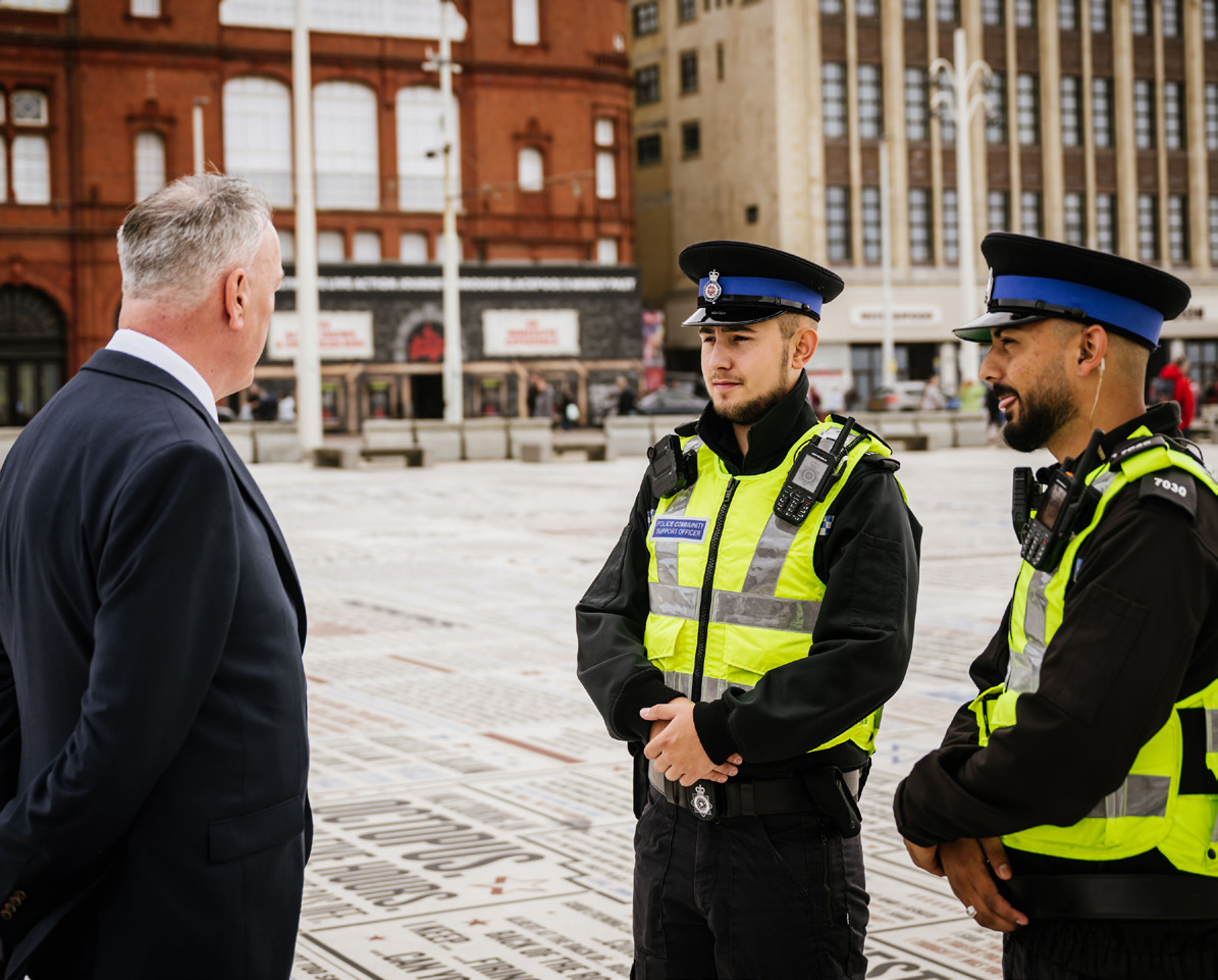 Clive Grunshaw and two police officers