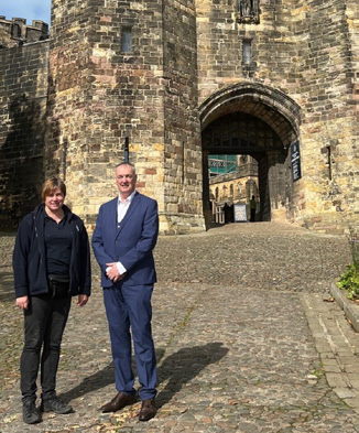 Clive Grunshaw outside Lancashire Police Museum with Lancaster Castle in the background